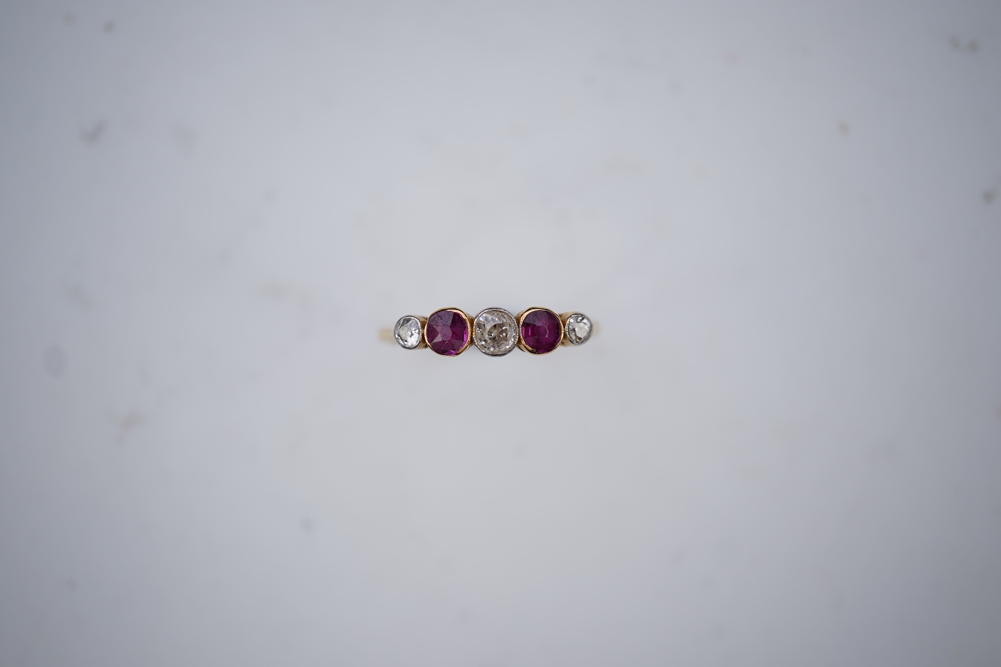 A ruby and diamond five-stone ring, early 20th century